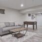 large basement with a modern interior design in bright lighting 85x85